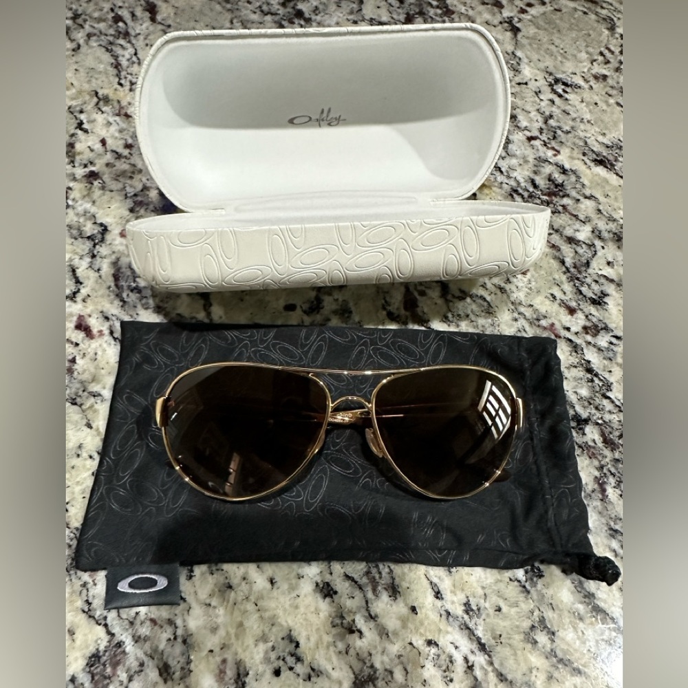 Oakley. Women’s Caveat sunglasses. Style: 004054-07. Brand new!